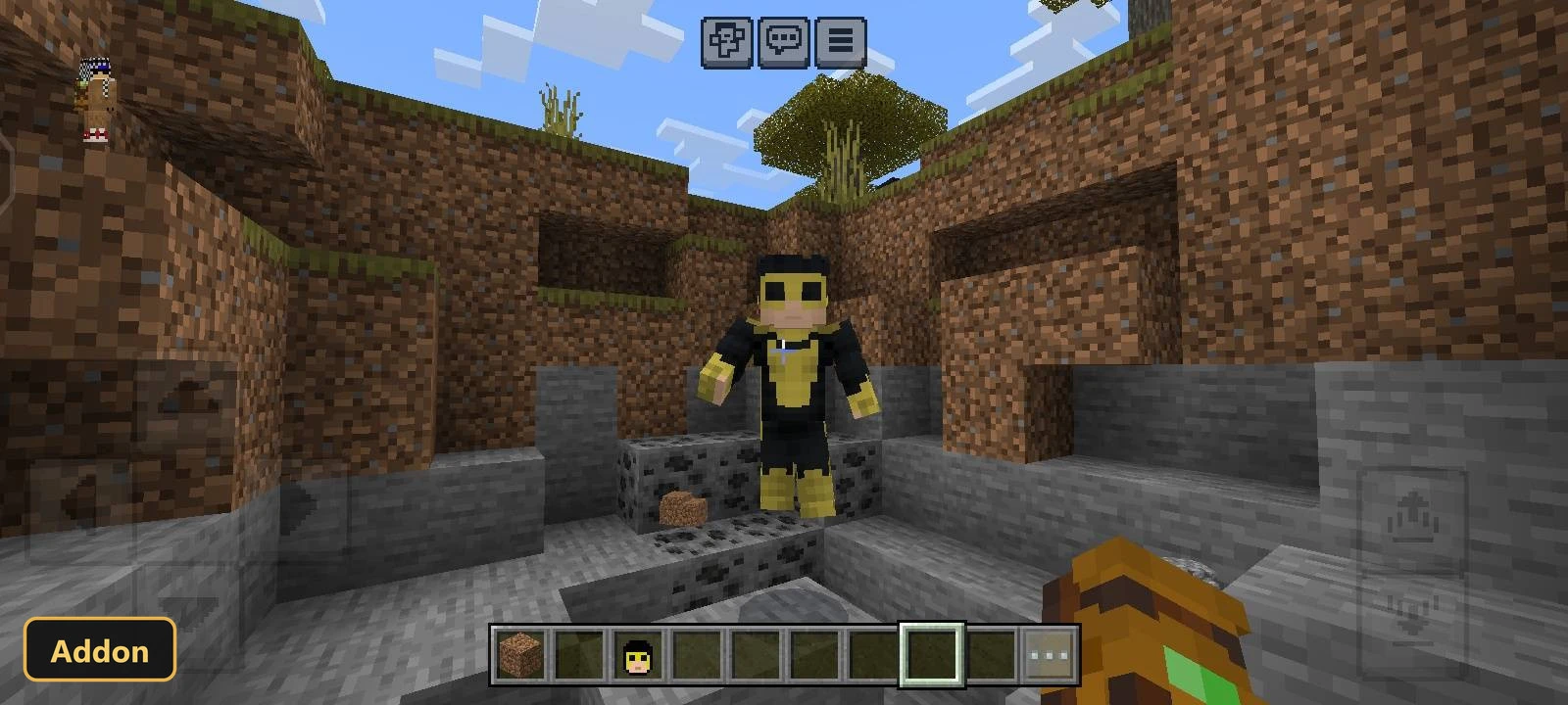 yellow-suited character skin in a rocky cave entrance