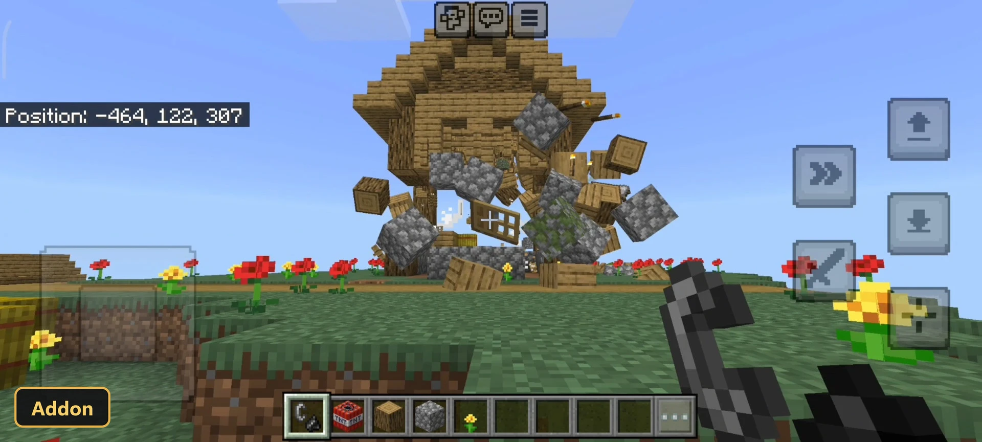 house exploding into debris over a flowery grass field
