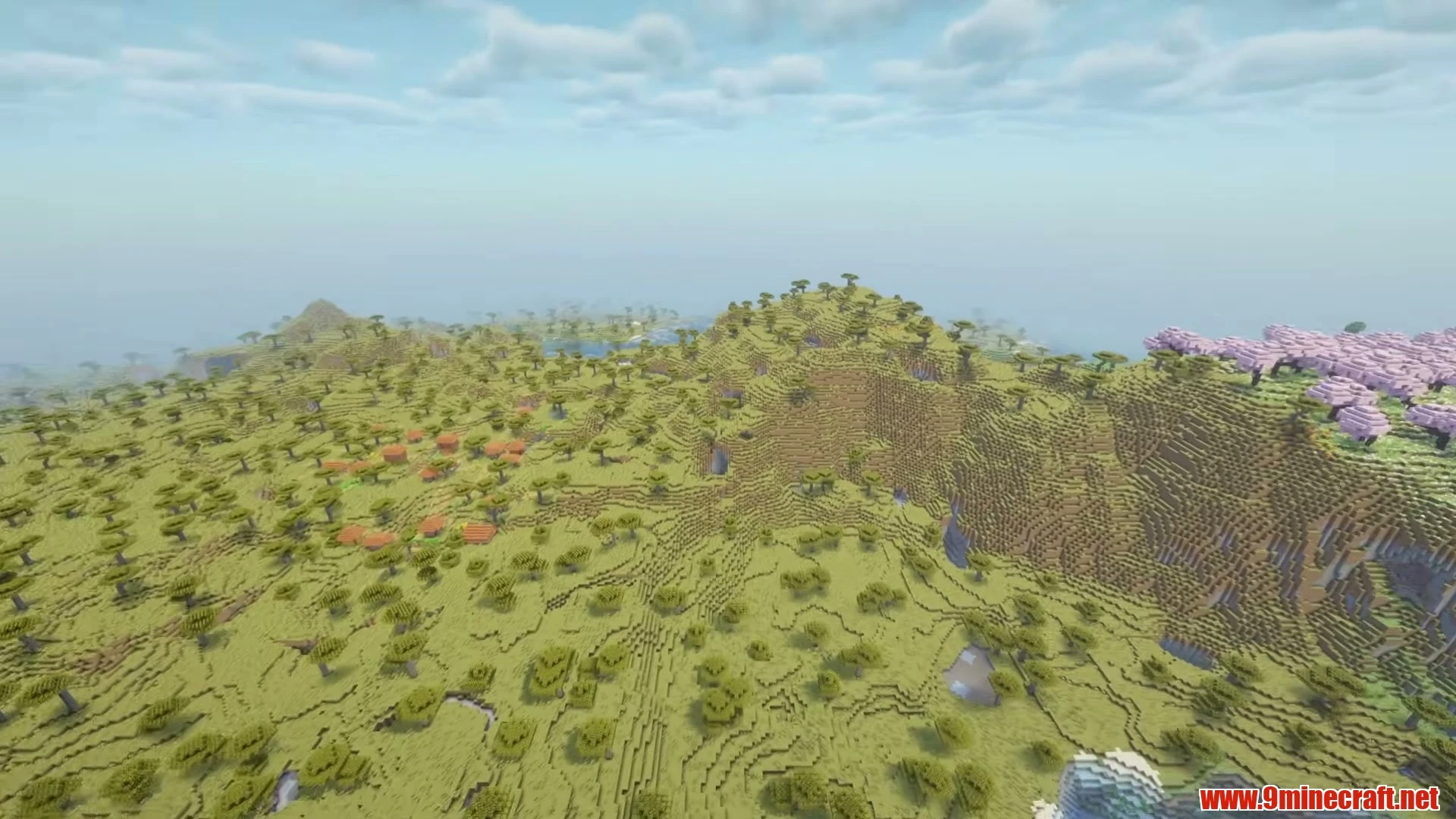 Lakeside Basin Village & Exposed Cave Mouth - Minecraft 26.3 Seed -1134873580560433779 View 2